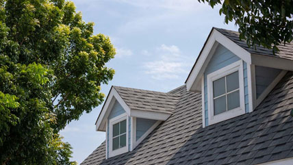 Gray shingles on the roof of a house