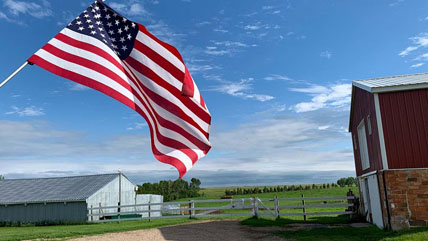 american flag flying for veterans in rural area